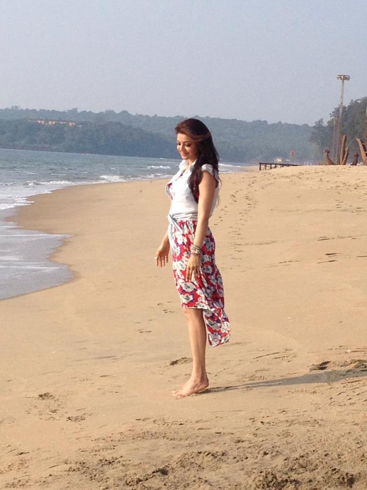 Kajal Aggarwal standing in a beach