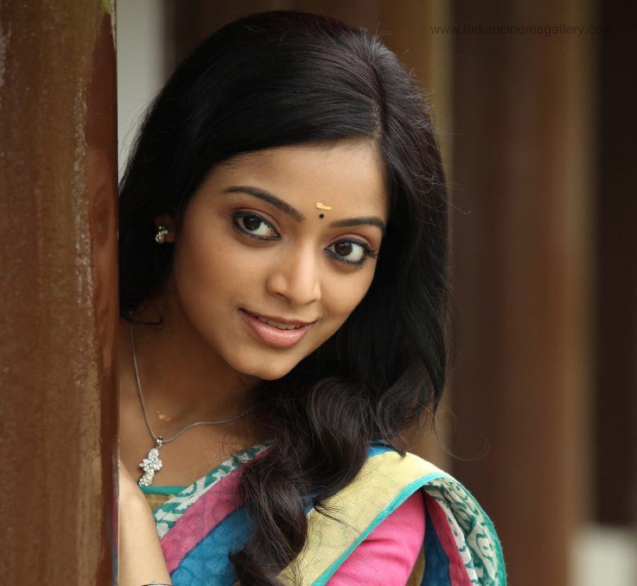 Tamil actress Janani smiling